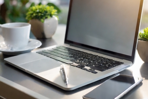 Laptop and a smart phone sitting on a desk